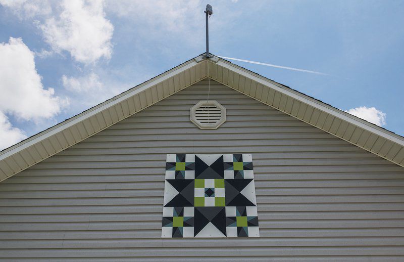 Area resident uses rural structures as backdrops for folk art